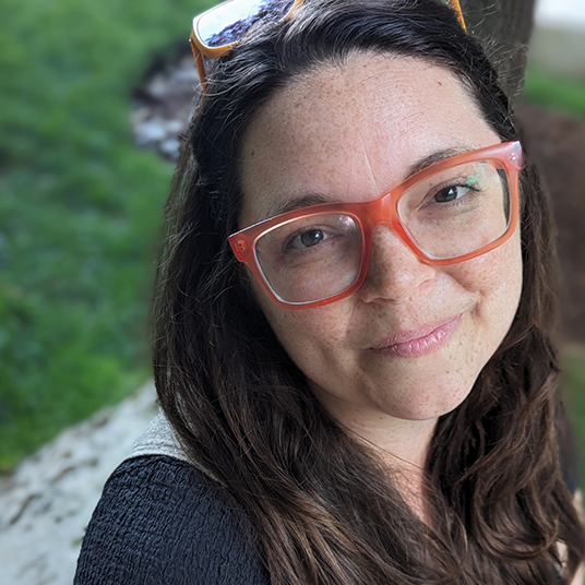 A headshot of Emily Comisar.